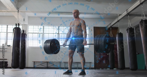 Lifting athlete performing deadlift in gym weight room, with barbell and digital overlay