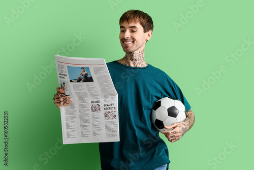 Happy young man with soccer...