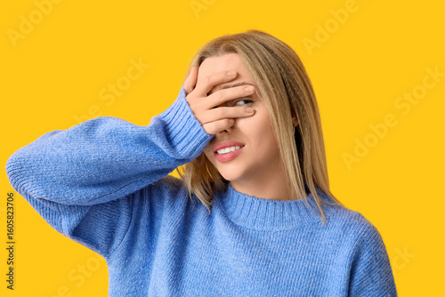 Young woman doing facepalm ...