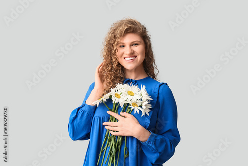 Smiling young woman with cu...