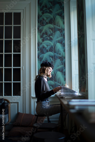 Young beautiful woman is reading book, studying, learning elegant environment. Literature, education, fashion, magazine, menu, information, natural lightening