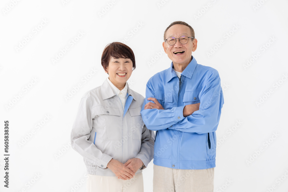 作業着を着た男女 作業着を着た男女