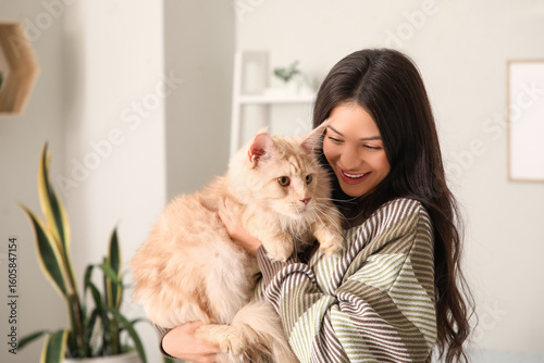 Pretty young woman holding ...