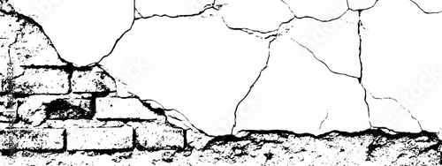 white surface with a network of black cracks across the surface area.