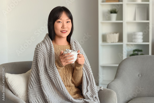 Young Asian woman with grey...