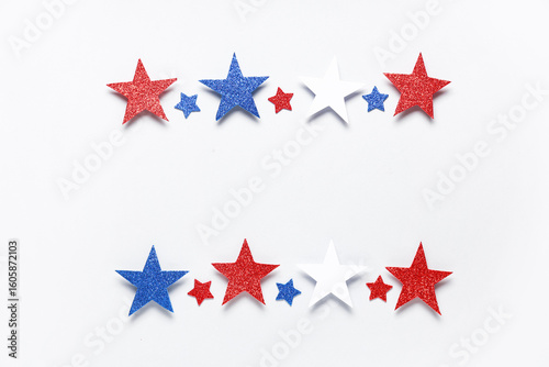 Paper stars in colors of USA flag for Independence Day on white background