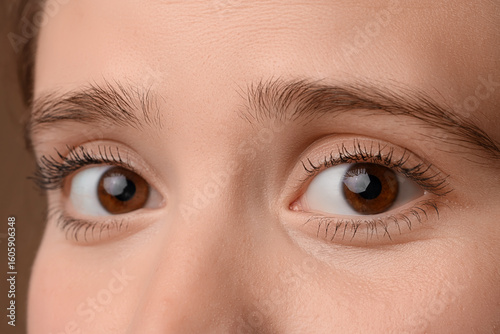 Woman with brown eyes on co...