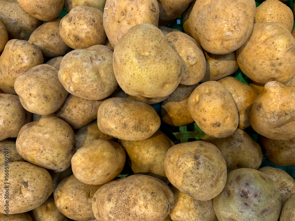 Freshly harvested potatoes displayed in the market Freshly harvested potatoes displayed in the market