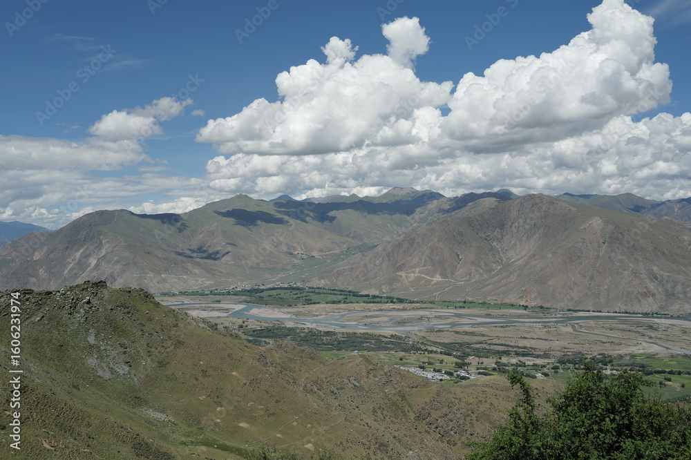 Fototapeta premium the village sits in the river valley on the tibetan plateau, the highest on earth