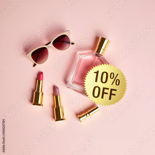 Cosmetic products including sunglasses, perfume, and lipsticks on pink background  