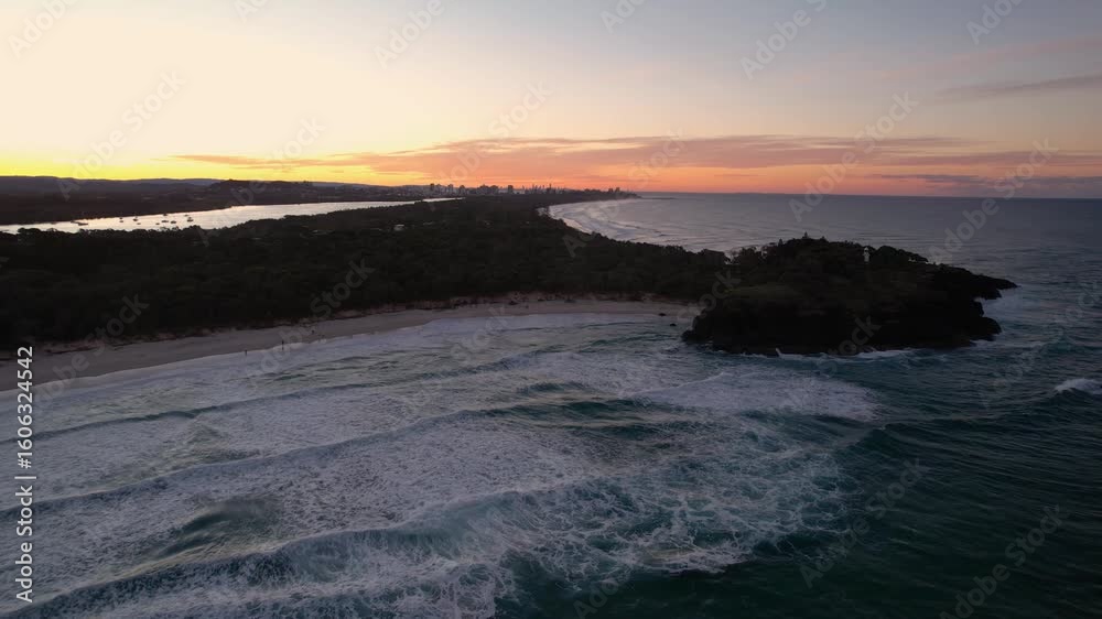 Aerial views of sunset over Fingal Head Lighthouse with the causeway rock formations below in Fingal Head, New South Wales, Australia Aerial views of sunset over Fingal Head Lighthouse with the causeway rock formations below in Fingal Head, New South Wales, Australia