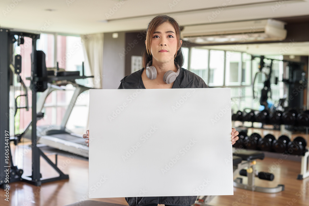 Obraz premium Confident Asian non binary transgender woman in gym training for healthy fitness lifestyle