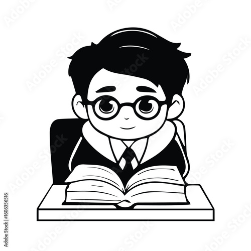 Young boy in formalwear seated at a desk reading an open book in a classroom setting. Student engrossed in learning with book in hand in a school environment.