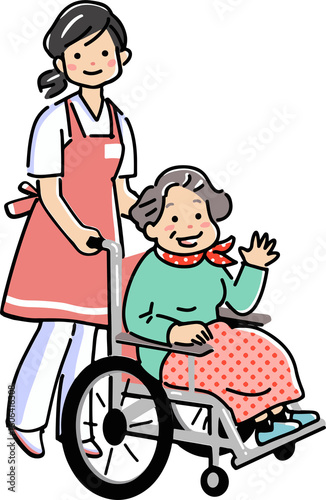 介護士と車椅子のシニア女性