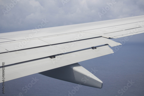 detail of the wing of an airplane with the flaps in motion during the
landing