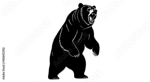 A powerful black silhouette of a large bear standing on its hind legs.