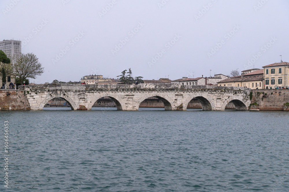 Fototapeta premium Ponte di Tiberio – Ancient Roman Bridge over Marecchia River in Rimini, Italy