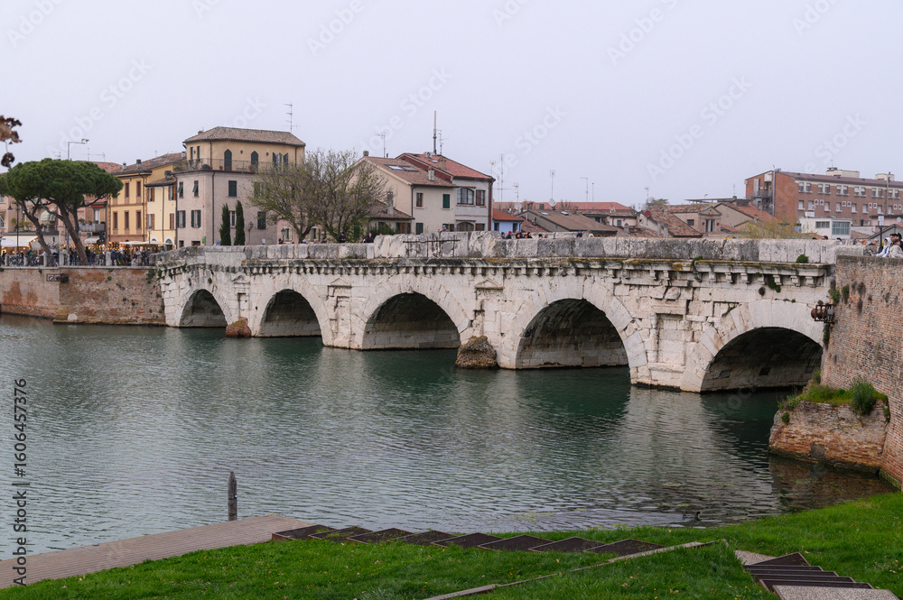 Fototapeta premium Ponte di Tiberio – Ancient Roman Bridge over Marecchia River in Rimini, Italy