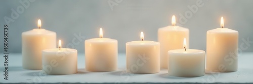 Several pristine white wax candles viewed from above, still life, christmas