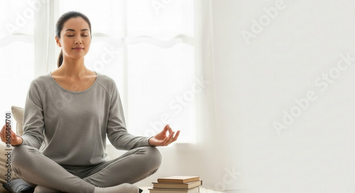 A Woman Practicing Meditation In A Light Filled Room