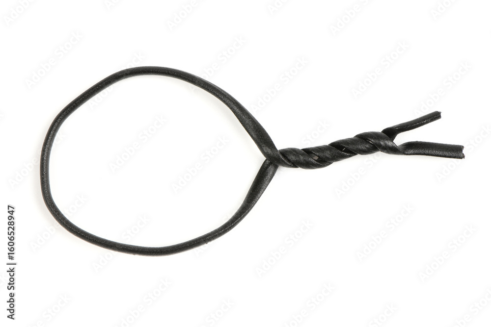 Black plastic coated wire tie used for a variety of things isolated on white background. Side view. Black plastic coated wire tie used for a variety of things isolated on white background. Side view.
