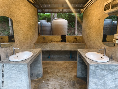 Modern Bathroom Sink: A clean and modern bathroom features two sleek sinks, set against a neutral-toned backdrop, designed with both functionality and aesthetic