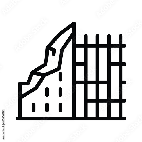 Fractured cliff face stabilized by a gridlike retaining wall
