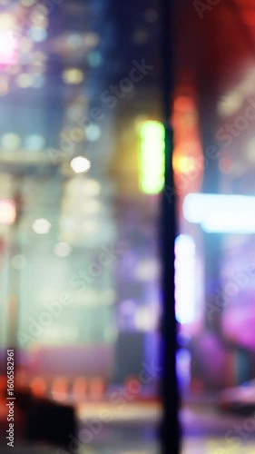 Wallpaper Mural Colorful neon lights fill the alleyway of a lively urban area at night. The blurred backdrop showcases buildings and vehicles, creating a vibrant city atmosphere alive with energy. Torontodigital.ca