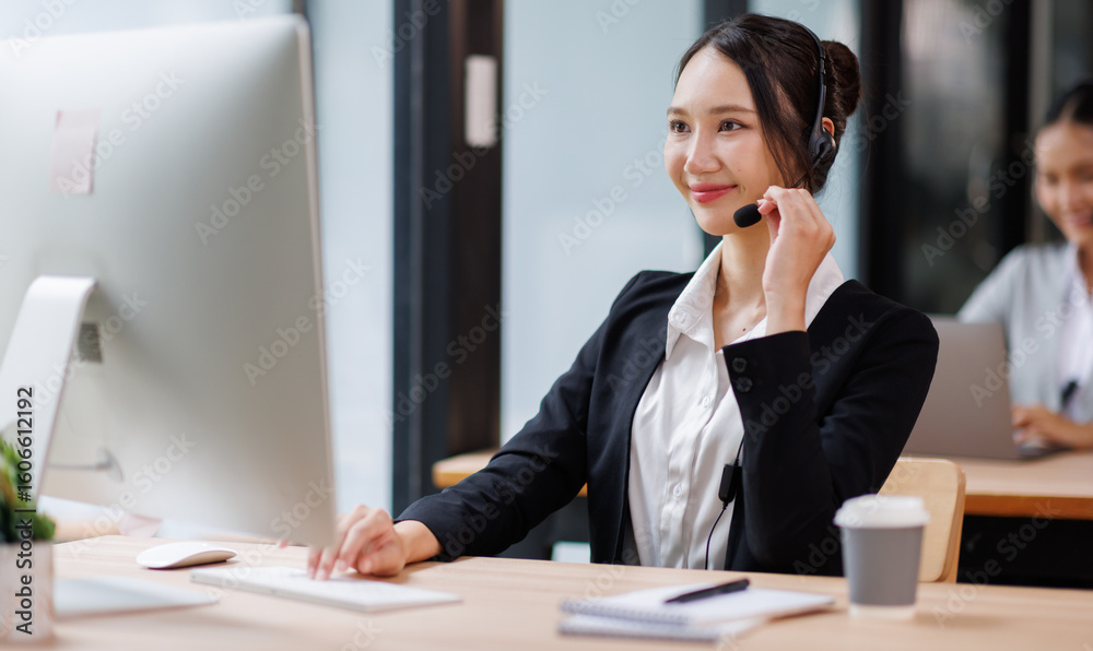 Asian Woman Wearing Headset Sitting At Desk Working In Office Call Centre Team
Asian Woman Wearing Headset Sitting At Desk Working In Office Call Centre Team