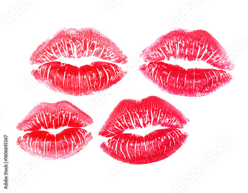 Four red lipstick kiss marks with detailed texture and creases, arranged in a square pattern on a black surface.