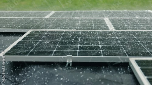 Hailstorm striking solar panels during heavy rain, highlighting the durability and weather resistance of solar energy systems