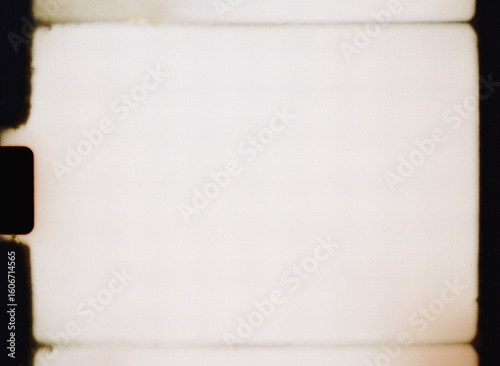 Old film frame showing light leaks and scratches as background texture