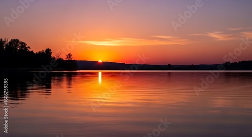 Calm lake at sunrise.