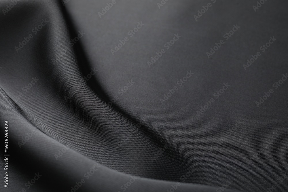 Fototapeta premium Crumpled black silk fabric as background, closeup