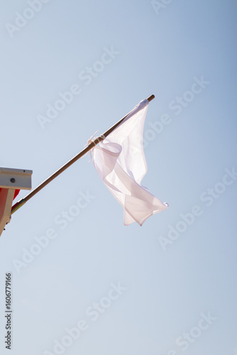 White flag on the beach lifeguard