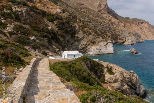 Fototapeta Naklejka Na Ścianę i Meble -  Stairs leading to a whitewashed chapel at Agia Anna beach on Amorgos Island, Cyclades, Greece
