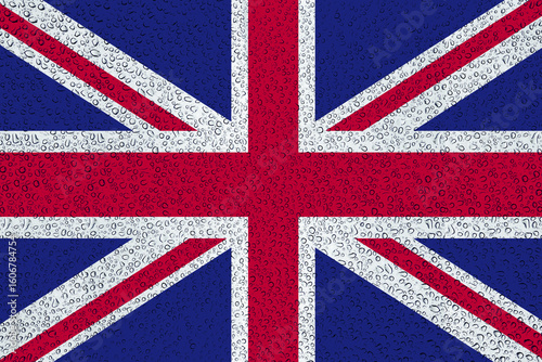 The British Union Jack, speckled with countless raindrops, evoking the characteristic UK weather and the enduring spirit of the nation. A vivid and textured visual