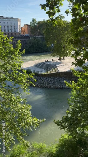 The Tiber River flows alongside Tiber Island in central Rome