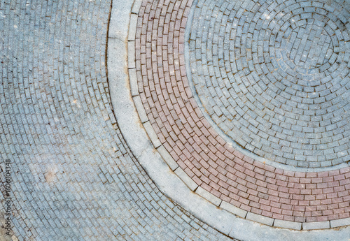 Circular paving pattern creating a stunning visual design. Top view of architecture detail