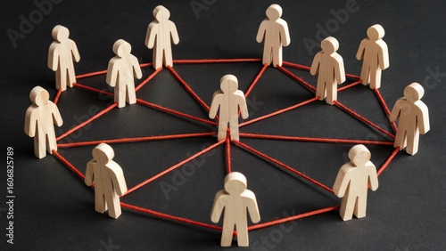 Wooden figures connected by red thread symbolize teamwork and strong community bonds