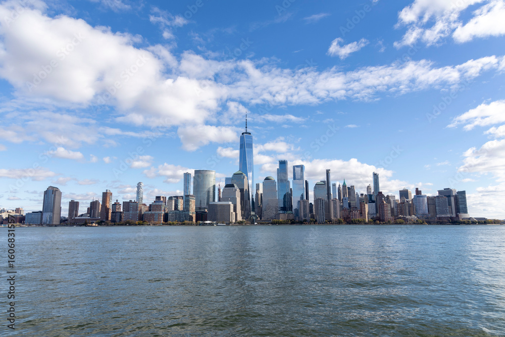 Fototapeta premium New York City skyline taken from New Jersey in a cold day of december. Sky is blue with few clouds. USA, NYC, NY, Manhattan