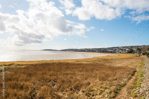 A beautiful seascape of the Grange-Over-Sands and saltmarsh beach on Morecambe Bay in Cumbria, UK.