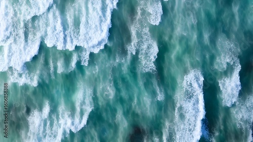 Icy winter ocean waves splashing on a blue shore with icicles on the roof
