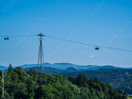 Cable Car Over Solina Lake Dam at Dusk with Full Moon in the Background, Bieszczady Mountains, Poland