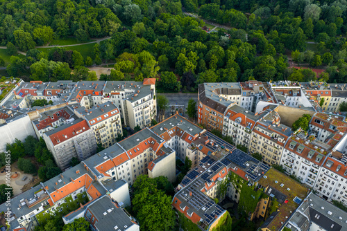 Aerial view of the dense urban layout with buildings and green spaces blending together, creating a vibrant tapestry of urban life., Berlin, Volkspark Friedrichshain, Germany.