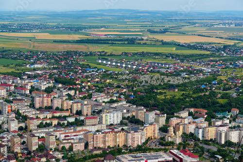 Fototapeta Naklejka Na Ścianę i Meble -  panoramic view from above on the street of city Piatra Neamt, Romania, city architecture, urban landscape