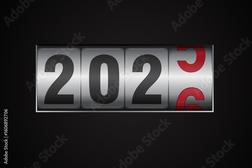 New year mechanical counter showing 2025 switching to 2026 on black background