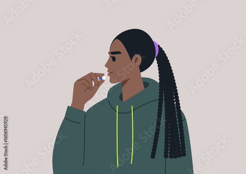 A female person in a cozy dark green hoodie thoughtfully prepares to take a pill, embracing a moment of self-care and reflection on health and well-being