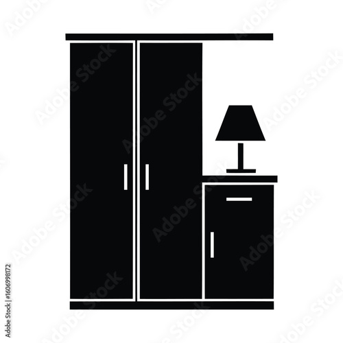 Silhouette of a wardrobe with a bedside table and lamp