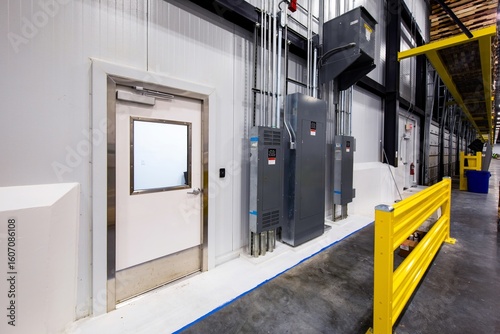 Quadro su tela Electrical panels and door inside refrigerated warehouse